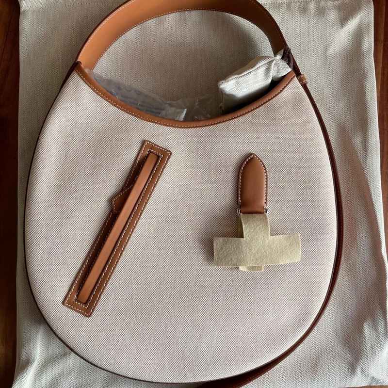 P’TIT ARÇON BAG IN CANVAS & LEATHER HERMÈS