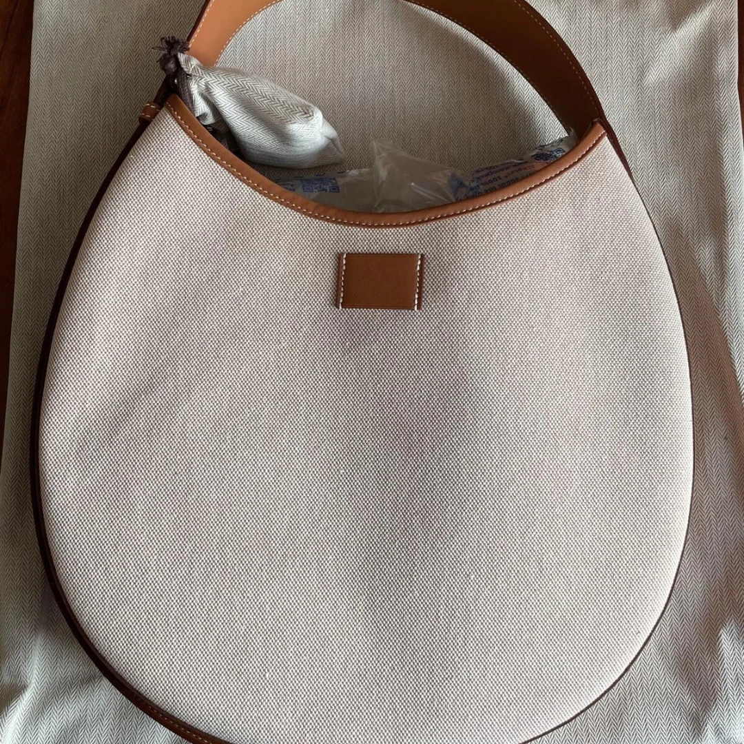 P’TIT ARÇON BAG IN CANVAS & LEATHER HERMÈS